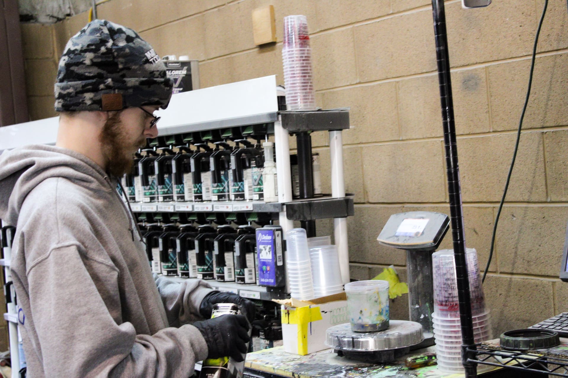 An Evolve Auto team member prepares for the preventive maintenance process
